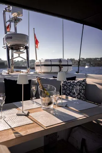  Yacht Photos Pics Luxury dining setup on 2019 Prestige 680 S yacht with scenic water view.