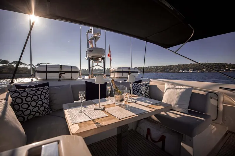  Yacht Photos Pics Luxurious 2019 Prestige 680 S yacht interior with elegant dining setup on deck.