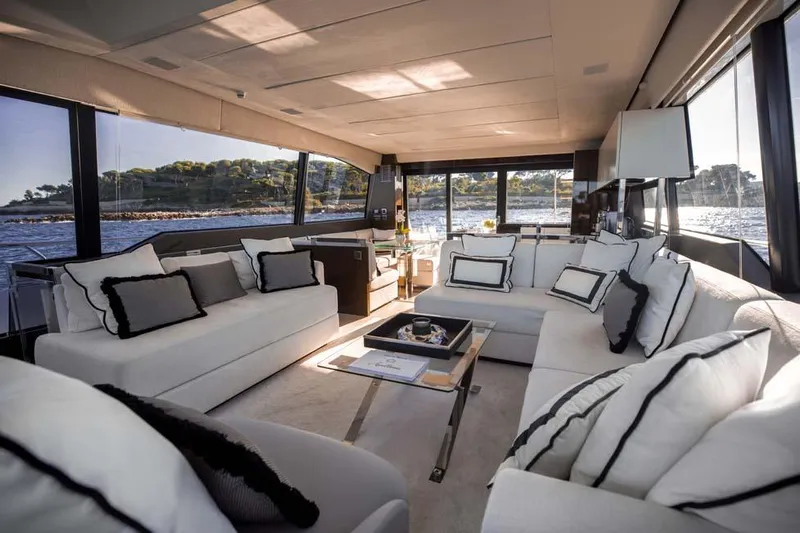  Yacht Photos Pics Luxurious interior of 2019 Prestige 680 S yacht with elegant seating and scenic ocean views.