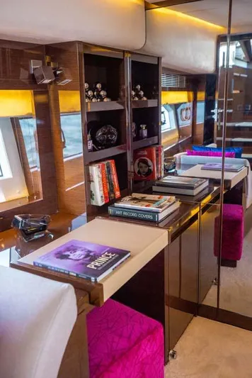 Yacht Photos Pics Luxurious interior of 2019 Prestige 680 S yacht with books and elegant decor.
