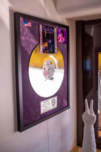  Yacht Photos Pics Framed gold record with album cover, displayed on a Prestige 680 S yacht, 2019 model.