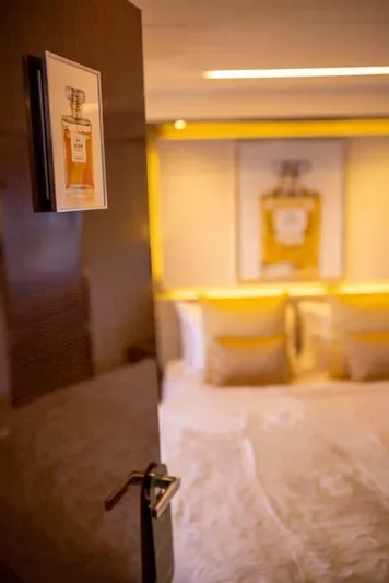  Yacht Photos Pics Luxurious bedroom interior on 2019 Prestige 680 S yacht, featuring elegant decor and soft lighting.