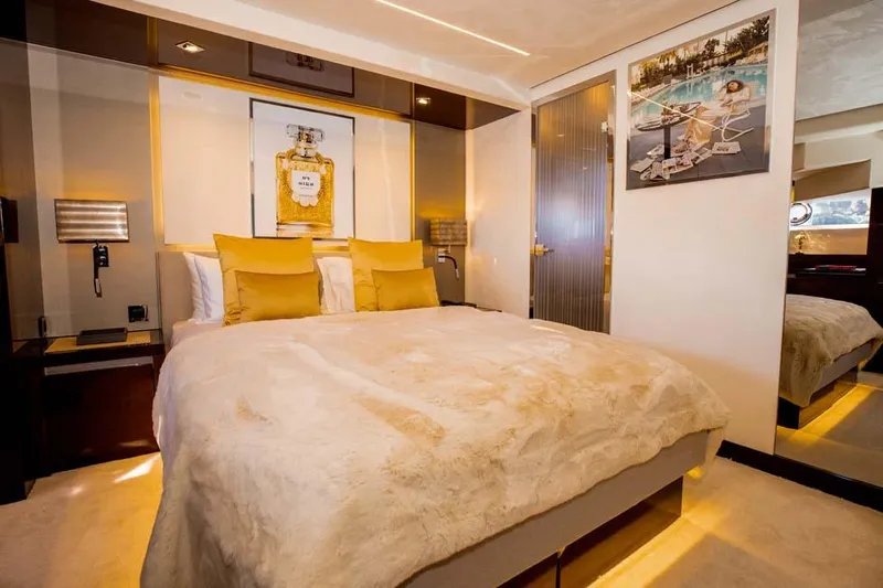  Yacht Photos Pics Luxurious bedroom interior on a 2019 Prestige 680 S yacht, featuring elegant decor and plush bedding.