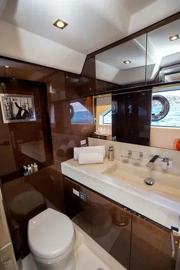  Yacht Photos Pics Luxurious bathroom in 2019 Prestige 680 S yacht with modern fixtures and ocean view.