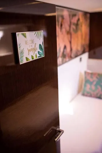  Yacht Photos Pics "Welcome to the Jungle" sign on Prestige 680 S yacht interior, 2019 model.