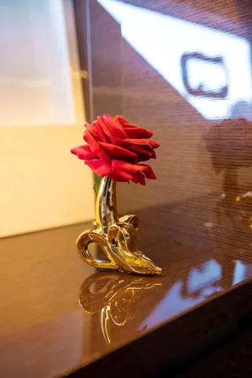  Yacht Photos Pics Elegant red rose in a golden vase on Prestige 680 S yacht, 2019 model.