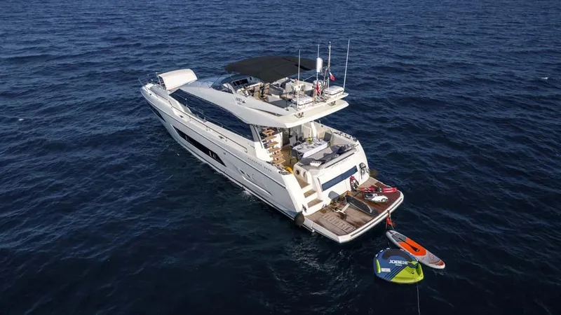  Yacht Photos Pics Luxurious 2019 Prestige 680 S yacht on open sea with water sports equipment.