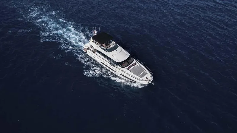  Yacht Photos Pics Aerial view of 2019 Prestige 680 S yacht cruising on open water.