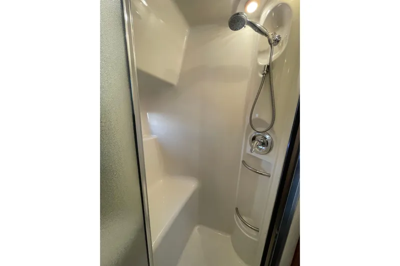 Happy Phantom Yacht Photos Pics Shower area in 1996 Bayliner 4087 Aft Cabin Motoryacht with handheld showerhead.