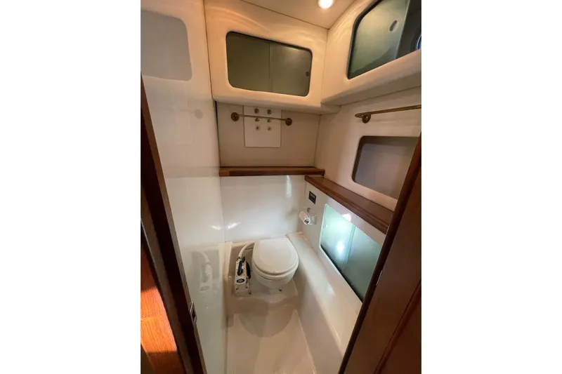Happy Phantom Yacht Photos Pics 1996 Bayliner 4087 Aft Cabin Motoryacht bathroom with modern fixtures and storage cabinets.