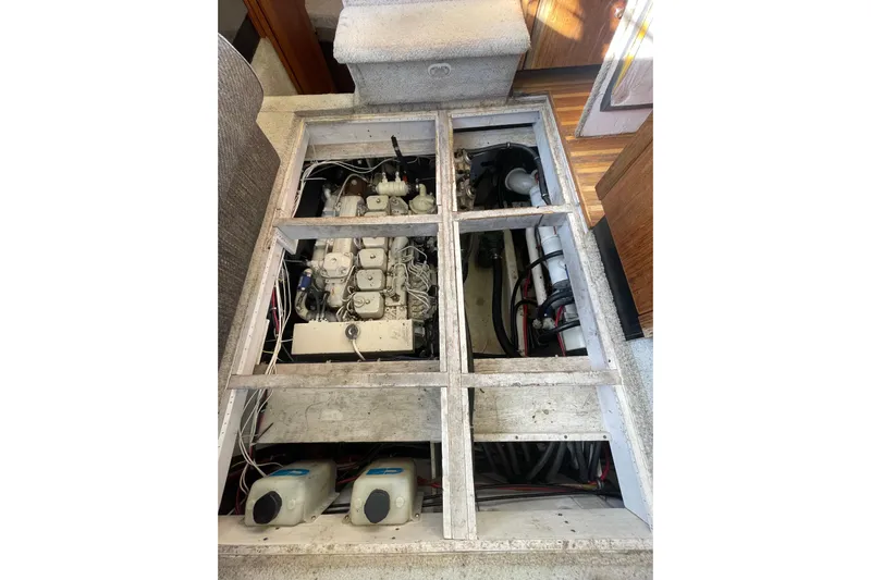 Happy Phantom Yacht Photos Pics 1996 Bayliner 4087 Aft Cabin Motoryacht engine compartment with visible machinery and components.