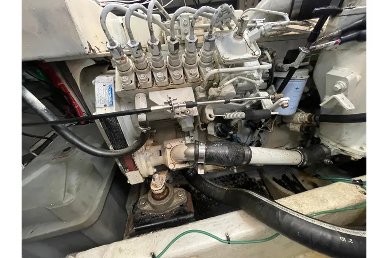 Happy Phantom Yacht Photos Pics Engine compartment of a 1996 Bayliner 4087 Aft Cabin Motoryacht, showcasing mechanical components.