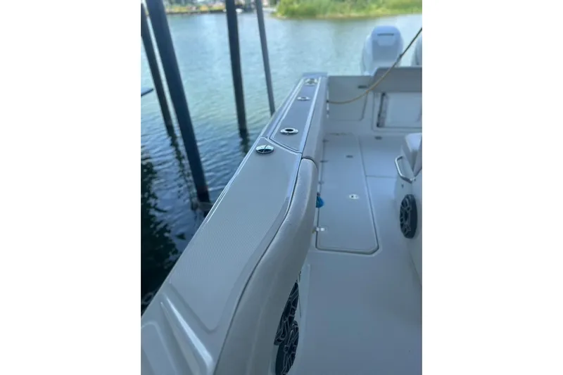  Yacht Photos Pics 2016 Boston Whaler 330 Outrage boat interior, showcasing sleek design and spacious deck.