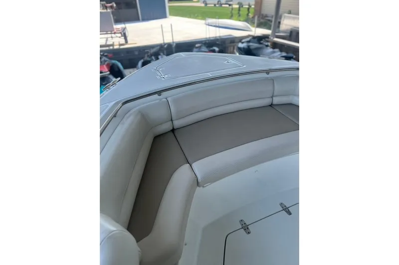 Yacht Photos Pics 2016 Boston Whaler 330 Outrage boat interior with cushioned seating.