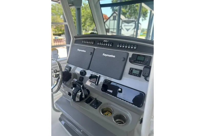  Yacht Photos Pics 2016 Boston Whaler 330 Outrage helm with Raymarine electronics and control panel.