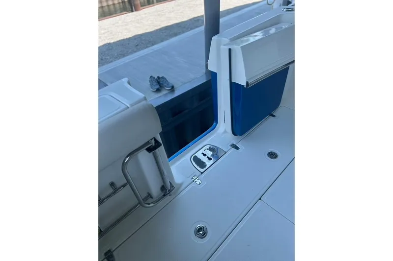  Yacht Photos Pics 2016 Boston Whaler 330 Outrage boat interior with seating and deck details.