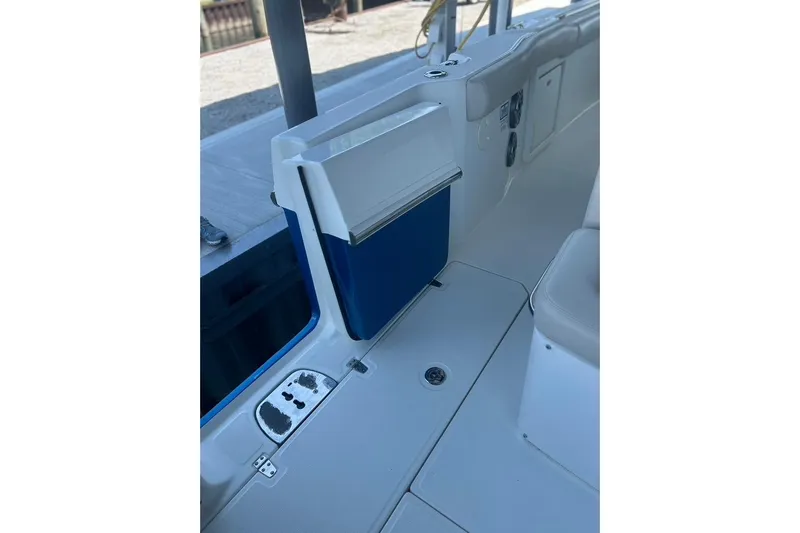  Yacht Photos Pics 2016 Boston Whaler 330 Outrage interior, featuring seating and storage compartments.