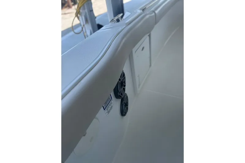  Yacht Photos Pics 2016 Boston Whaler 330 Outrage interior detail with speakers and storage compartment.