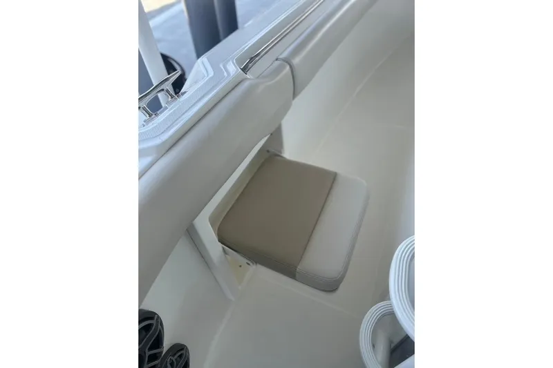  Yacht Photos Pics 2016 Boston Whaler 330 Outrage boat seat detail with beige cushion.