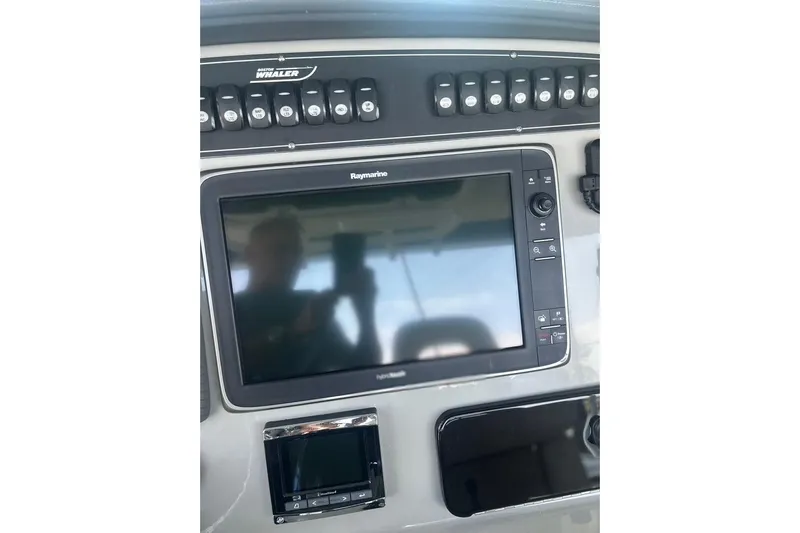  Yacht Photos Pics Control panel of 2016 Boston Whaler 330 Outrage with Raymarine display.