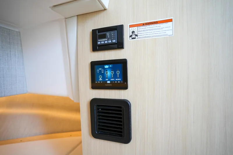  Yacht Photos Pics 2024 Regal 38 SAV interior control panel with digital displays and vent.