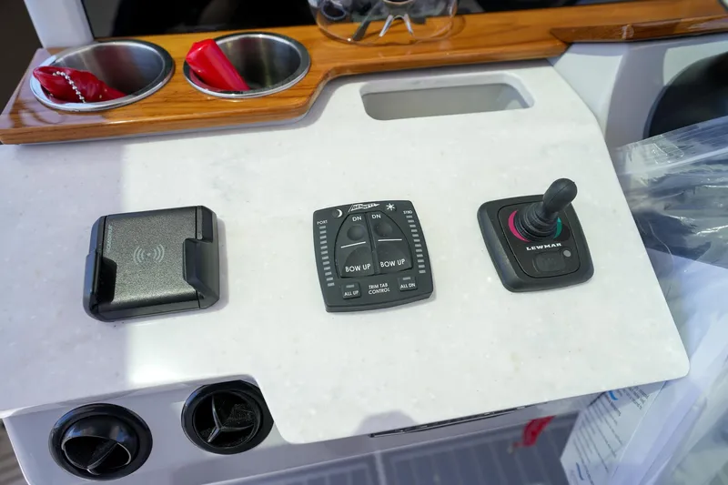  Yacht Photos Pics Control panel of 2024 Regal 38 SAV boat with joystick and cup holders.