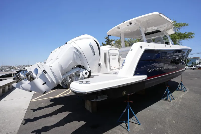  Yacht Photos Pics 2024 Regal 38 SAV boat with Yamaha engines on display outdoors.