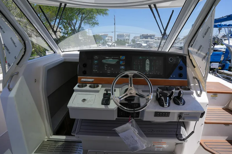  Yacht Photos Pics 2024 Regal 38 SAV boat helm with modern controls and navigation system.