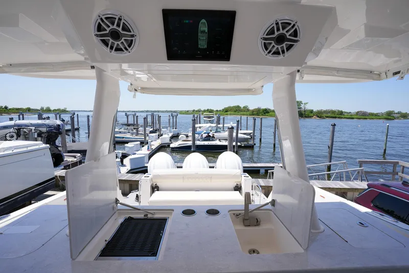  Yacht Photos Pics 2024 Regal 38 SAV yacht interior with sink, grill, and marina view.