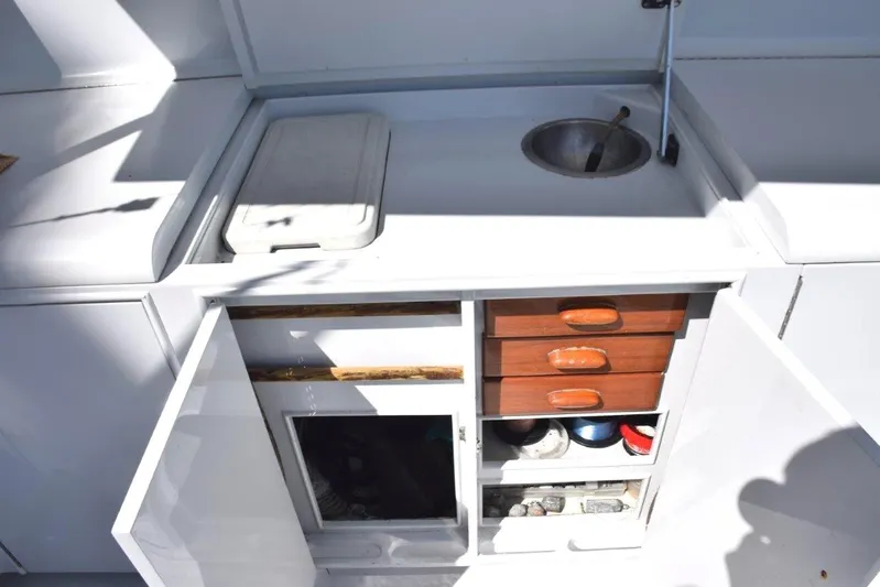 Low Bidder X Yacht Photos Pics Cockpit tackle center with sink and cooler