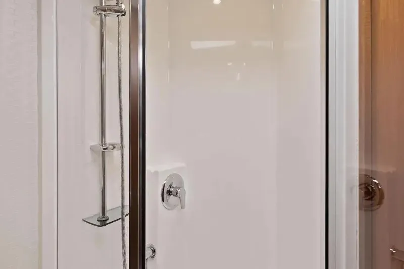  Yacht Photos Pics Shower area in 2012 Cabo 44 Hardtop Express yacht, featuring sleek chrome fixtures.