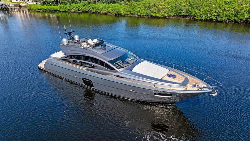 G Yacht Photos Pics Luxury 2021 Pershing 74 yacht cruising on a serene waterway.