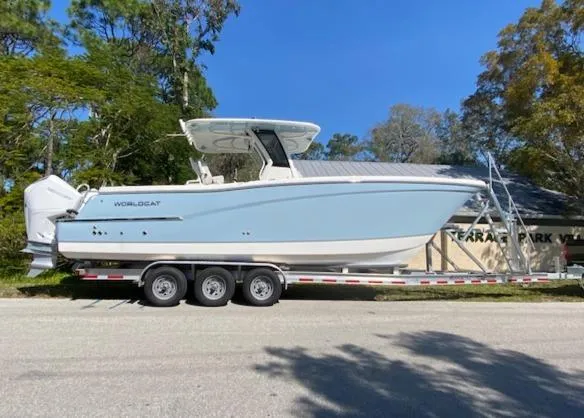 Wcn 51105 280ccx Coastbl Merc Yacht Photos Pics 2024 World Cat 280 CC-X boat on a trailer, side view.