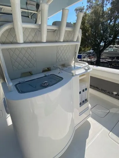 Wcn 51105 280ccx Coastbl Merc Yacht Photos Pics 2024 World Cat 280 CC-X boat interior with rod holders and storage compartments.
