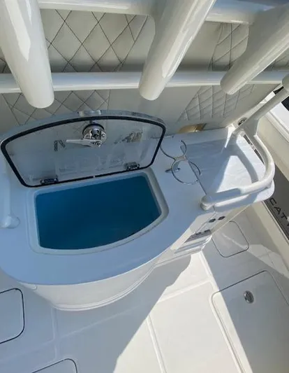 Wcn 51105 280ccx Coastbl Merc Yacht Photos Pics 2024 World Cat 280 CC-X boat interior with livewell and rod holders.
