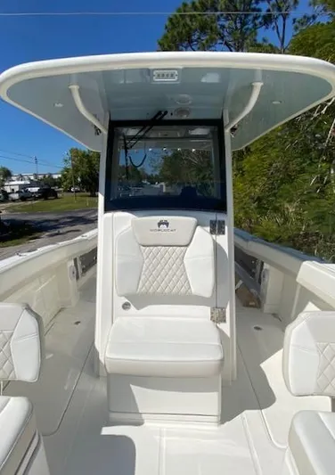 Wcn 51105 280ccx Coastbl Merc Yacht Photos Pics 2024 World Cat 280 CC-X boat interior with white seating and console.