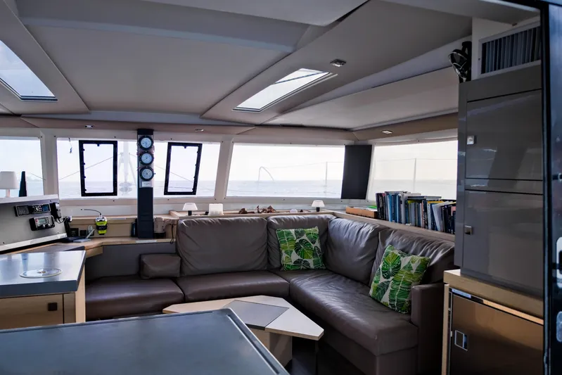 Long Story Yacht Photos Pics Luxurious interior of 2019 Fountaine Pajot Saona 47 catamaran with plush seating and ocean view.
