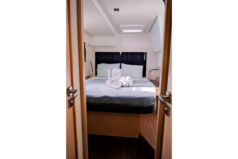 Long Story Yacht Photos Pics Luxurious cabin interior of 2019 Fountaine Pajot Saona 47 catamaran with elegant bedding.