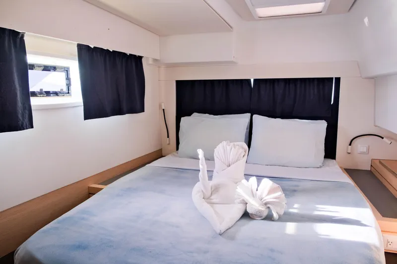 Long Story Yacht Photos Pics Luxurious cabin interior of 2019 Fountaine Pajot Saona 47 catamaran with elegant bedding.