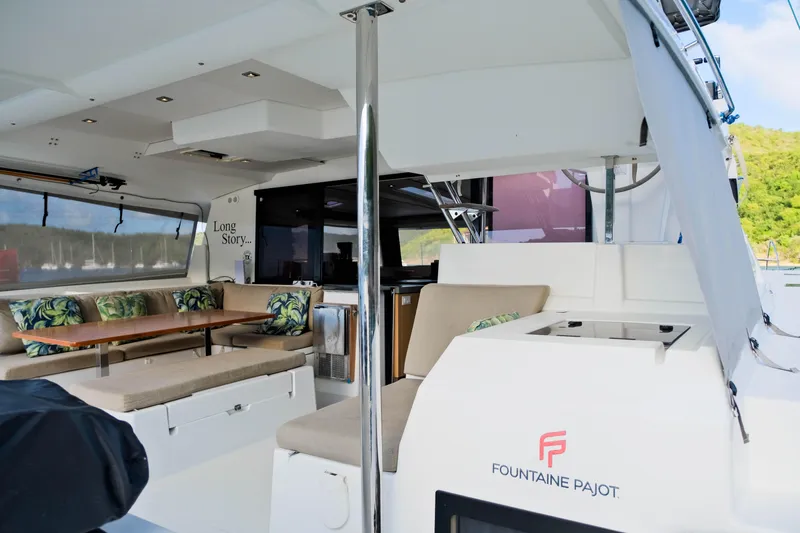 Long Story Yacht Photos Pics Spacious interior of 2019 Fountaine Pajot Saona 47 catamaran with seating and dining area.