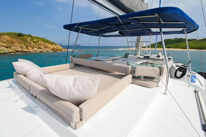 Nae Kae Yacht Photos Pics Luxurious Bali 5.4 catamaran deck with sunbeds, ocean view, and island backdrop, 2022 model.