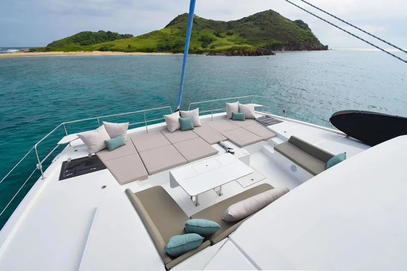 Nae Kae Yacht Photos Pics Luxurious 2022 Bali 5.4 yacht with spacious deck, ocean view, and island backdrop.