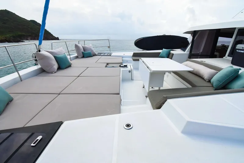 Nae Kae Yacht Photos Pics Luxurious 2022 Bali 5.4 yacht deck with cushioned seating and ocean view.