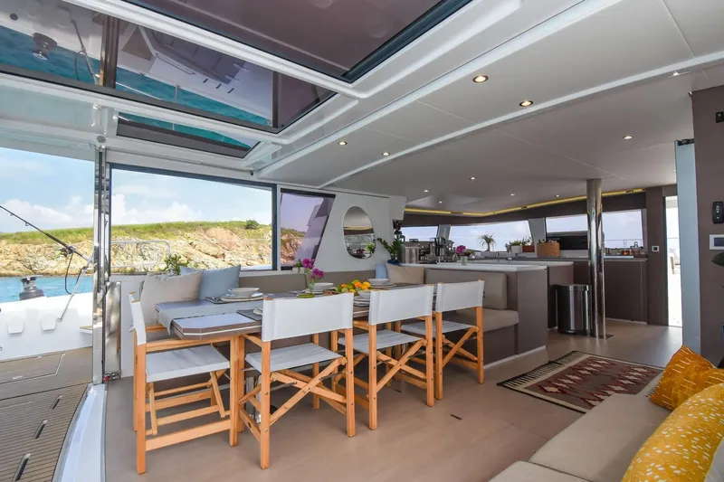 Nae Kae Yacht Photos Pics Luxurious interior of 2022 Bali 5.4 yacht with dining area and scenic ocean view.