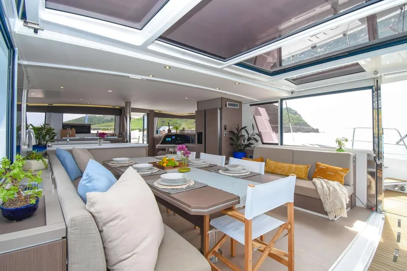Nae Kae Yacht Photos Pics Luxurious Bali 5.4 yacht interior, 2022 model, featuring elegant dining area with scenic ocean views.