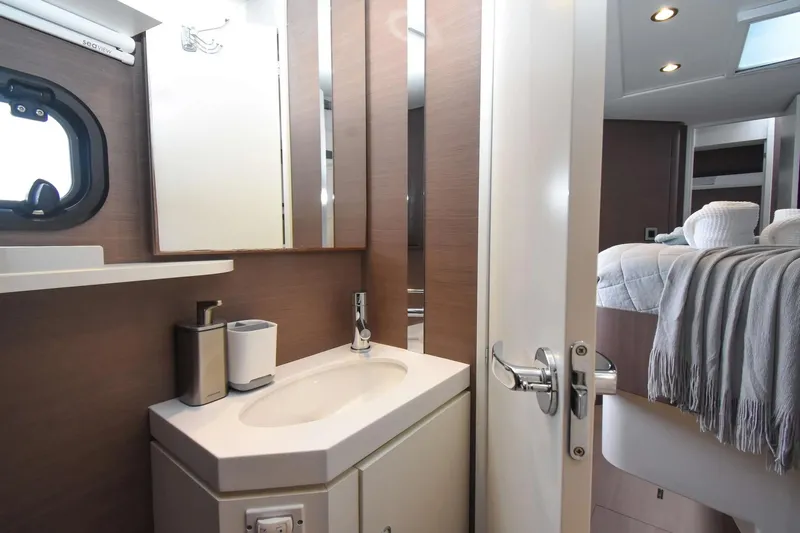 Nae Kae Yacht Photos Pics Modern bathroom and bedroom interior on a 2022 Bali 5.4 yacht, featuring sleek design elements.