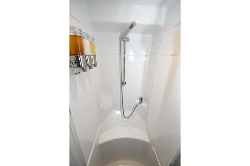 Nae Kae Yacht Photos Pics Compact shower area in 2022 Bali 5.4 model with wall-mounted dispensers.