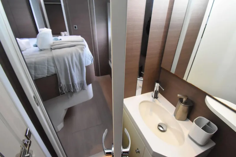 Nae Kae Yacht Photos Pics Interior of 2022 Bali 5.4 yacht showing bedroom and bathroom with modern design.