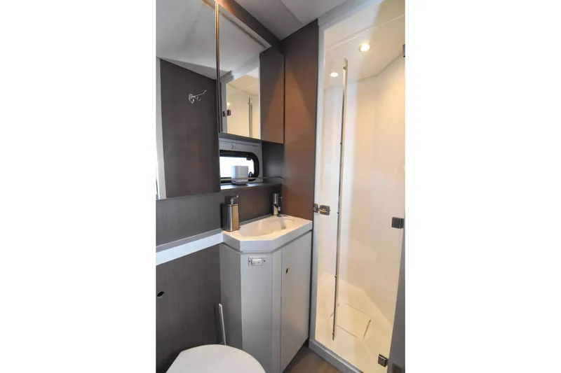 Nae Kae Yacht Photos Pics Modern bathroom interior in 2022 Bali 5.4 model yacht, featuring shower and sink.