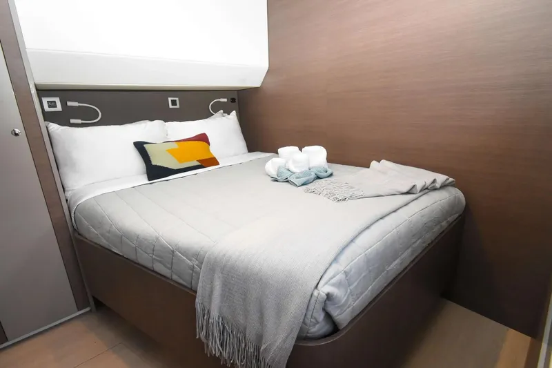 Nae Kae Yacht Photos Pics Cozy cabin bedroom in 2022 Bali 5.4 yacht with modern decor and soft lighting.